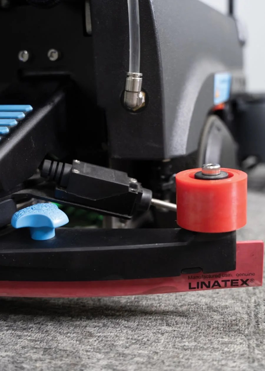 A close view of the LionsBot R3 Scrub Pro brush deck and Linatex squeegee blade