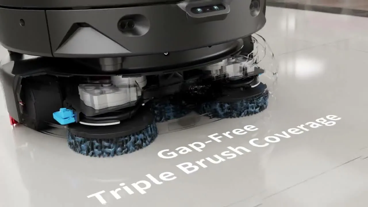Water pouring over a spinning LionsBot R5 brush