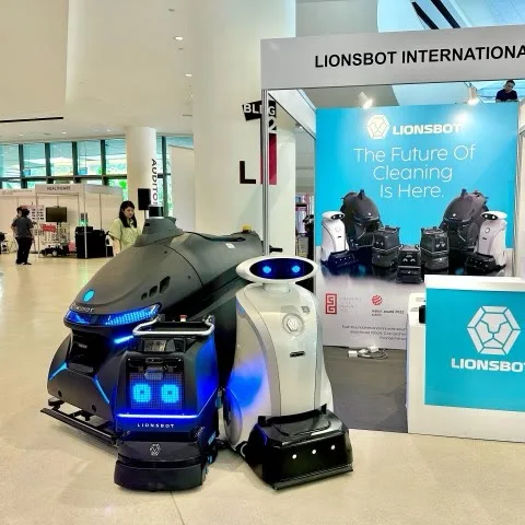 LionsBot robots on display beside a LionsBot International exhibition stand at the National Robotics Programme festival