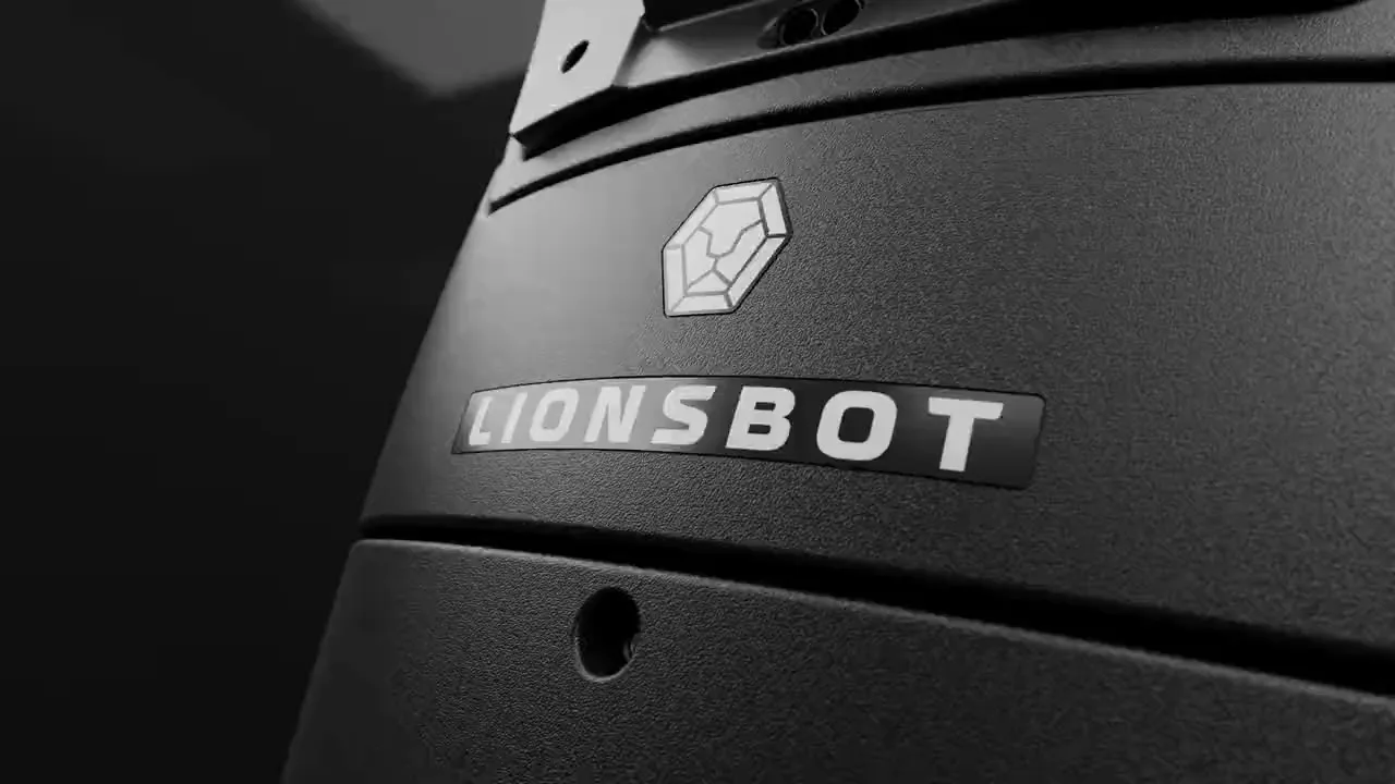 A close view of the LionsBot mark on the R5 shell, lit in a dark corridor