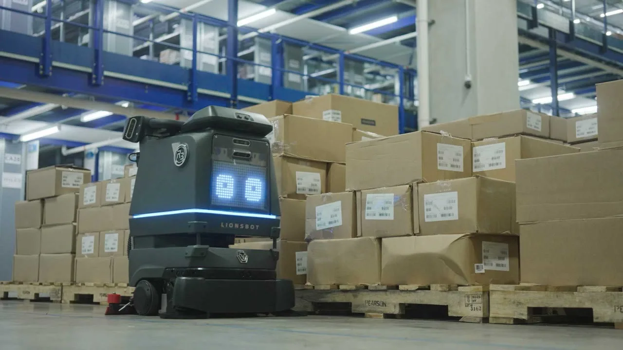 LionsBot R3 Scrub Pro working along a warehouse aisle
